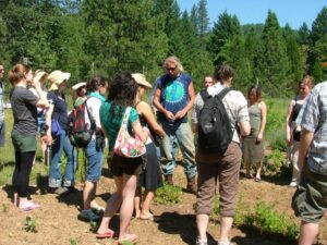 Bastyr students with Richo Cech, advocate for UpS and hard-to-grow herbs, on location at Strictly Medicinal